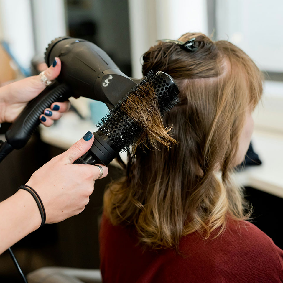 Professional makeup application at Veloura
